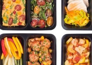 Healthy take away meals in containers isolated on white background, top view Healthy take away meals in containers isolated on white background, top view